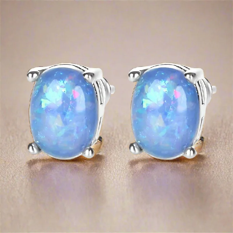 glamorous earrings for women -Blue Simulated Fire Opal Oval Solitaire On 14K White Gold Plated Stud Earrings for Woman